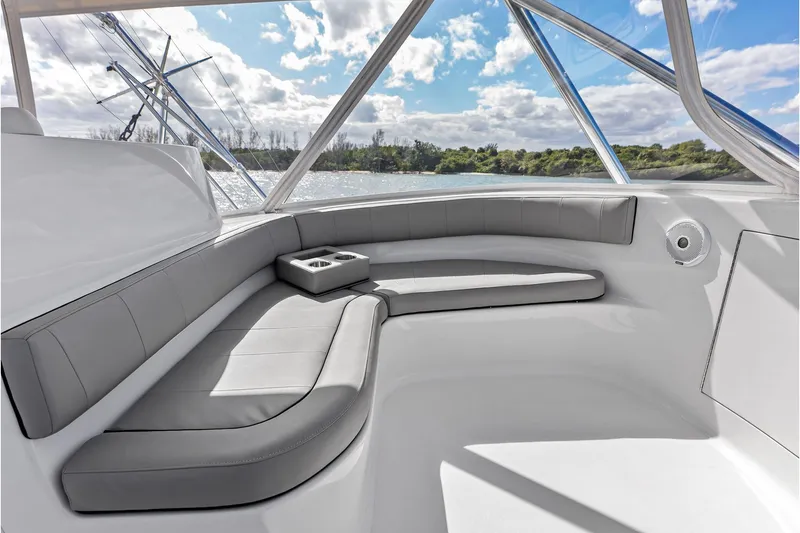 Slide: The Image of Luxurious seating area on a 2017 Spencer Convertible boat, with scenic water view. - 34