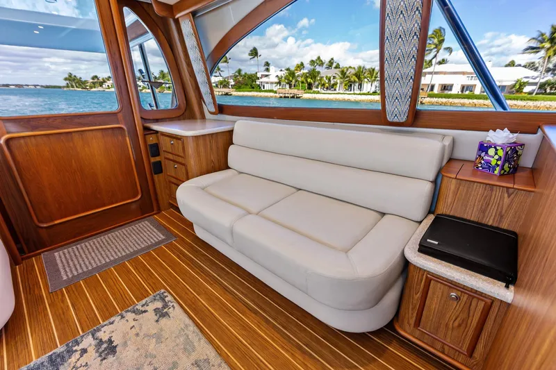Slide: The Image of Luxurious interior of a 2017 Spencer Convertible yacht with elegant wood finishes and comfortable seating. - 36