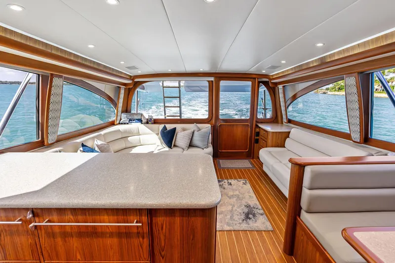 Slide: The Image of Luxurious interior of a 2017 Spencer Convertible yacht with elegant wood finishes and plush seating. - 37