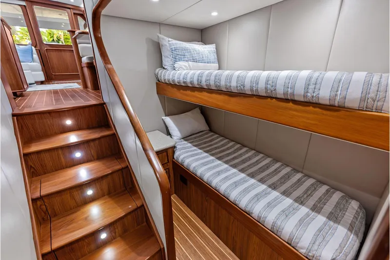 Slide: The Image of Luxurious 2017 Spencer Convertible yacht interior with wooden stairs and cozy bunk beds. - 44