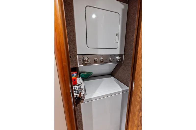 Slide: The Image of Stacked washer and dryer in a compact wooden closet, Spencer Convertible 2017. - 45