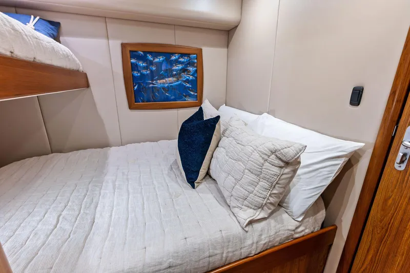 Slide: The Image of Cozy cabin interior of 2017 Spencer Convertible with bed and ocean-themed artwork. - 47