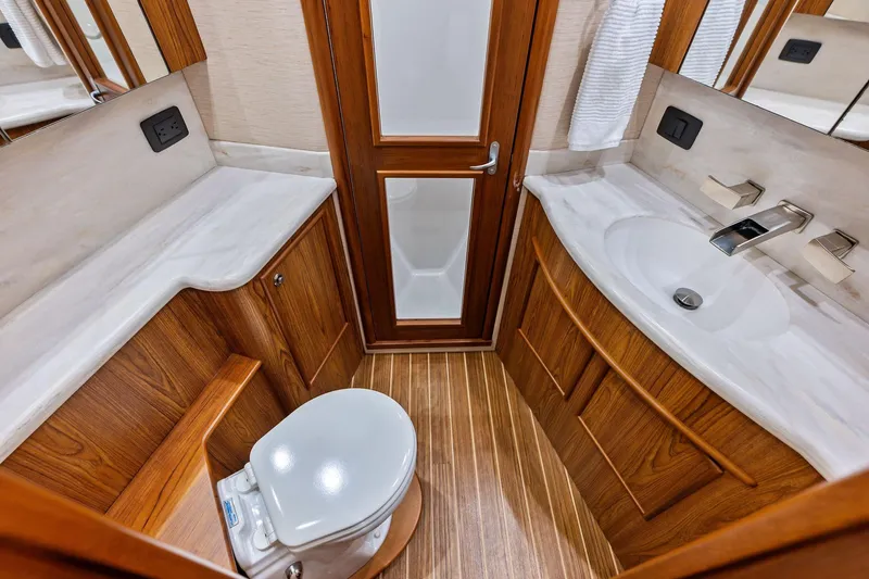 Slide: The Image of Luxurious 2017 Spencer Convertible bathroom with wooden cabinetry and modern fixtures. - 48