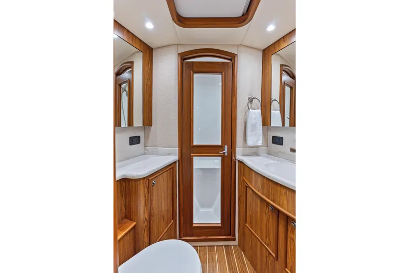 Slide: The Image of Luxurious 2017 Spencer Convertible bathroom with wooden cabinetry and modern fixtures. - 50