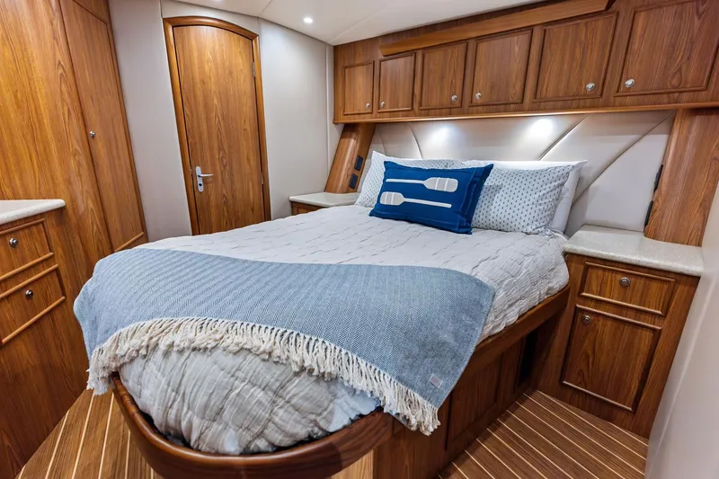 Slide: The Image of Luxurious 2017 Spencer Convertible yacht bedroom with wooden cabinetry and cozy bedding. - 53