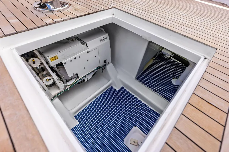 Slide: The Image of Engine compartment of a 2017 Spencer Convertible boat with wooden deck. - 59