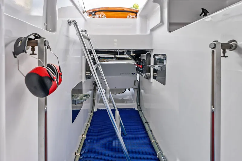 Slide: The Image of Interior view of a 2017 Spencer Convertible boat engine compartment with ladder and equipment. - 61