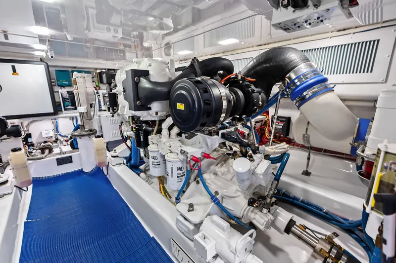 Slide: The Image of Engine room of a 2017 Spencer Convertible boat, showcasing complex machinery and components. - 66