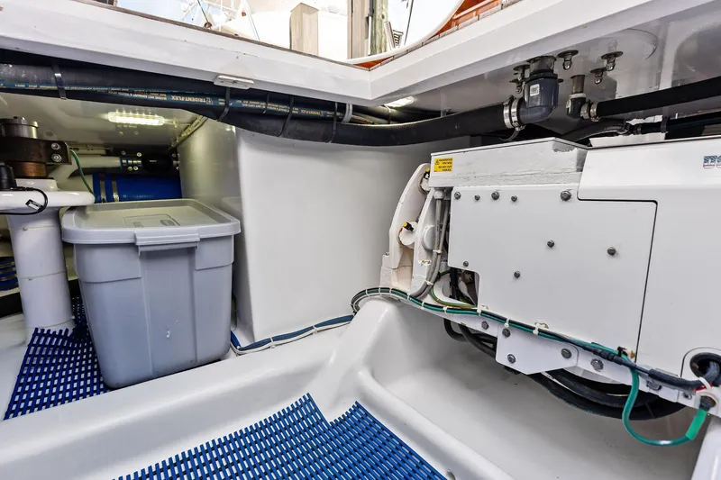 Slide: The Image of 2017 Spencer Convertible engine room with storage bin and mechanical components. - 68