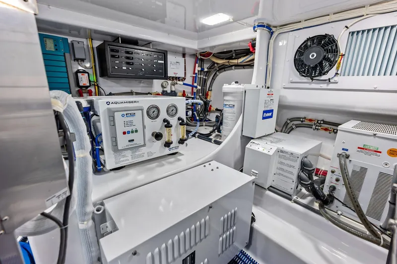 Slide: The Image of Engine room of a 2017 Spencer Convertible with advanced control panels and equipment. - 71