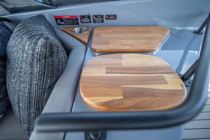 Slide: The Image of Interior of 2026 Hanover 387 boat with wooden accents and cushioned seating. - 16