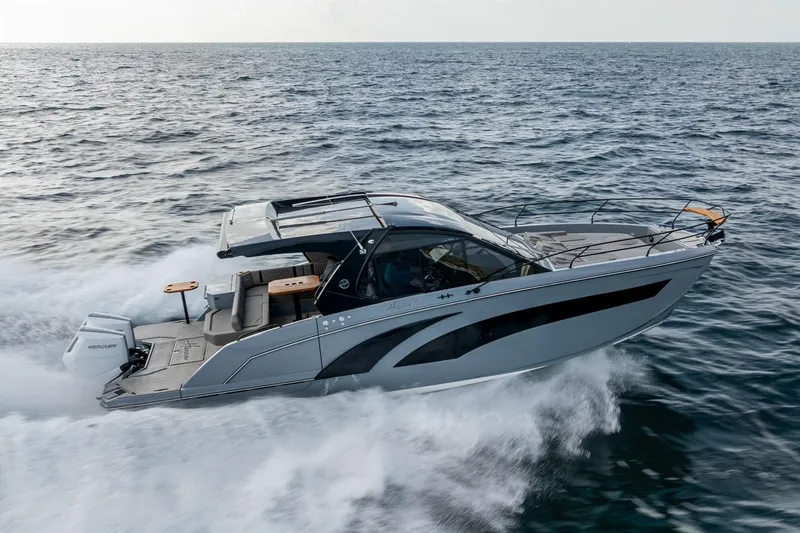 Slide: The Image of 2026 Hanover 387 boat cruising on open water, showcasing sleek design and powerful performance. - 2