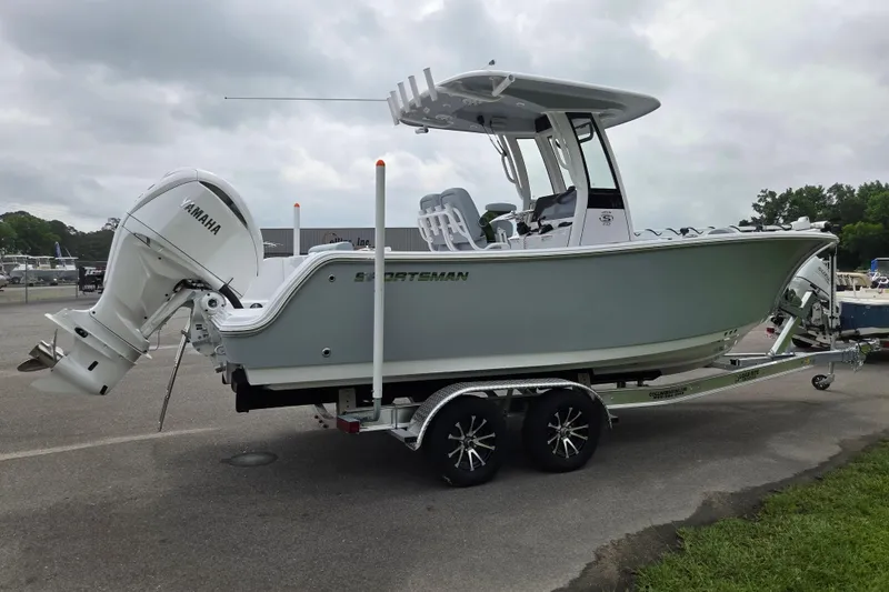 Slide: The Image of 2026 Sportsman Open 232 Center Console boat on trailer, featuring Yamaha outboard motor. - 5