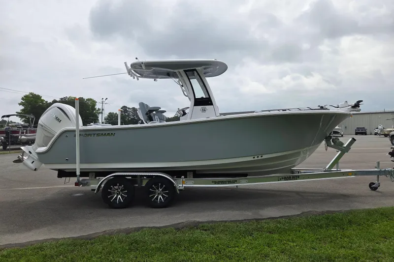 Slide: The Image of 2026 Sportsman Open 232 Center Console boat on trailer, parked outdoors. - 6