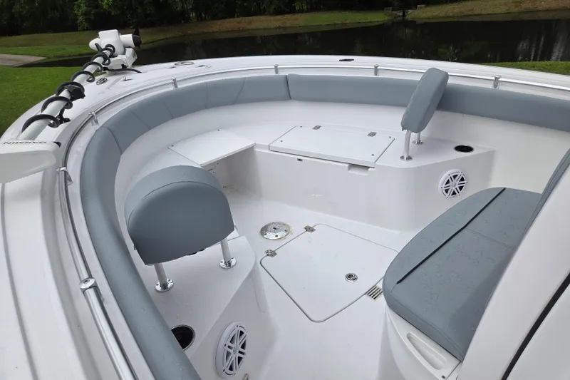 Slide: The Image of 2026 Sportsman Open 232 Center Console boat interior with seating and storage compartments. - 8