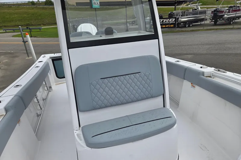 Slide: The Image of 2026 Sportsman Open 232 Center Console boat with cushioned seating and sleek design. - 9