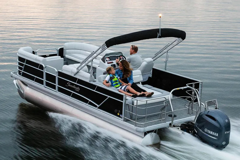 Slide: The Image of Manufacturer Provided Image: 2019 Sweetwater 2286 SFL pontoon boat cruising on a lake with passengers. - 13