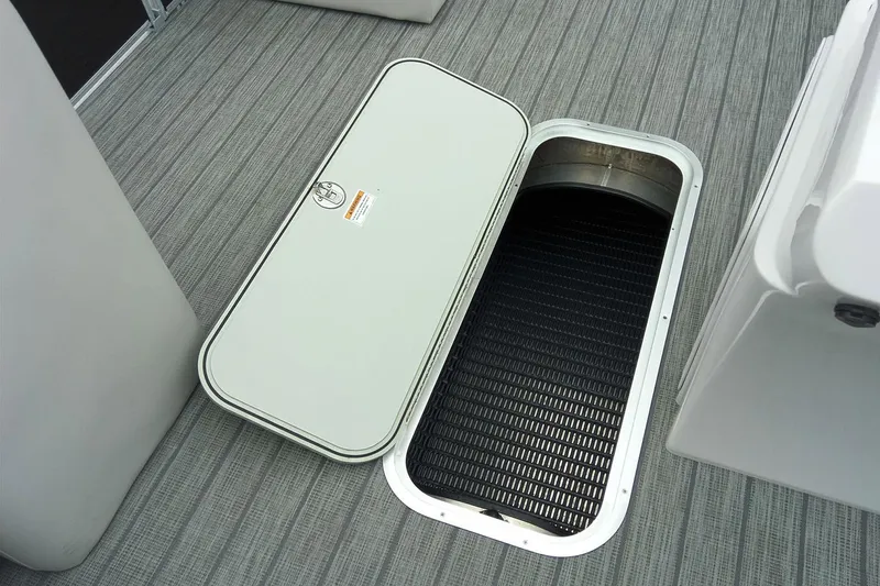 Slide: The Image of Manufacturer Provided Image: Open storage compartment on 2019 Sweetwater 2286 SFL boat with gray flooring. - 24