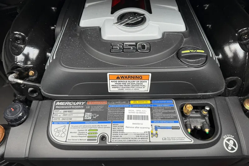 Slide: The Image of Engine of 2026 Crownline 288 SS boat with Mercury maintenance schedule and warning label. - 9