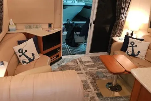 Slide: The Image of Interior of a 2003 Meridian 381 Sedan yacht with nautical-themed decor. - 12