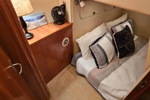 Slide: The Image of Cozy cabin interior of 2003 Meridian 381 Sedan with bed and wooden furnishings. - 17