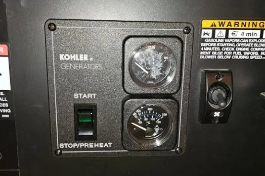 Slide: The Image of Control panel of a Kohler generator on a 2003 Meridian 381 Sedan boat. - 19