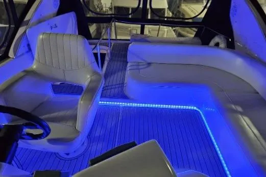 Slide: The Image of Luxurious 2003 Meridian 381 Sedan interior with blue LED lighting and plush seating. - 21