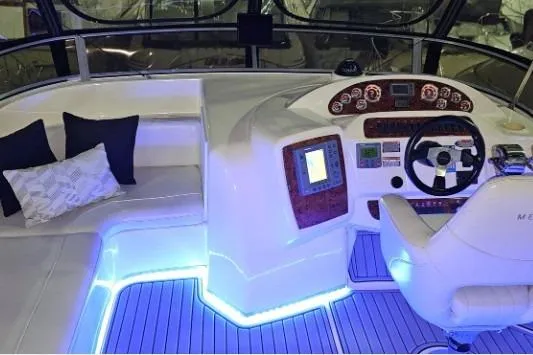 Slide: The Image of Luxurious 2003 Meridian 381 Sedan yacht interior with illuminated helm and seating area. - 22