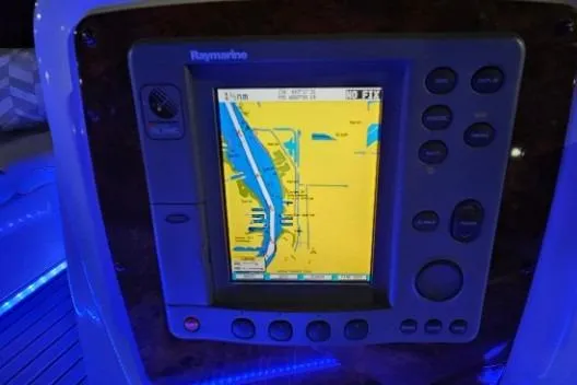 Slide: The Image of Raymarine navigation system on 2003 Meridian 381 Sedan boat, displaying nautical chart. - 24