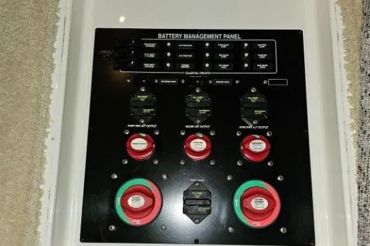 Slide: The Image of Battery management panel on 2003 Meridian 381 Sedan boat, featuring switches and controls. - 28