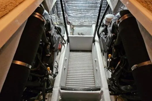 Slide: The Image of Engine room of a 2003 Meridian 381 Sedan boat, showcasing dual engines and mechanical components. - 29