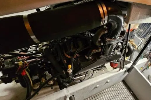 Slide: The Image of Engine compartment of a 2003 Meridian 381 Sedan boat, showcasing mechanical components. - 30