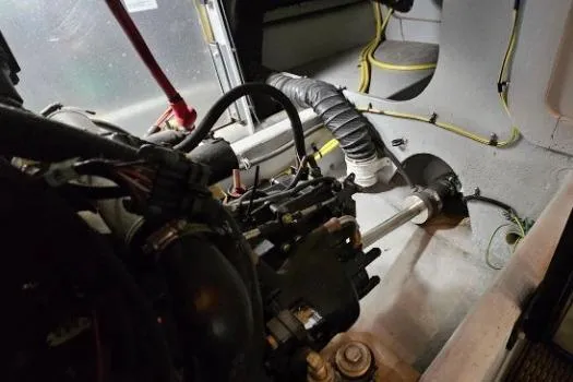 Slide: The Image of Engine compartment of a 2003 Meridian 381 Sedan boat, showing mechanical components and wiring. - 32