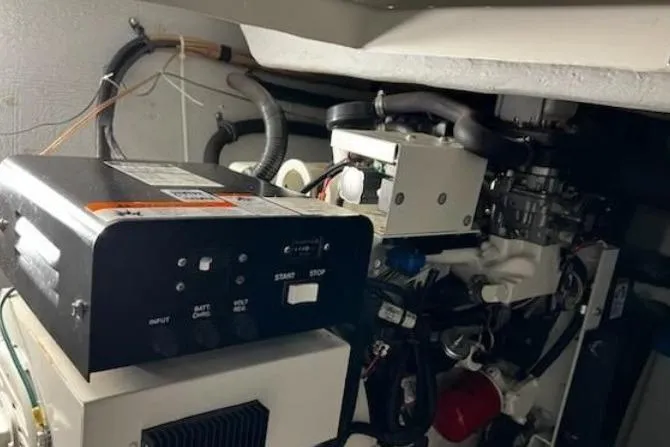 Slide: The Image of Engine room of a 2003 Meridian 381 Sedan boat, showcasing mechanical components. - 35