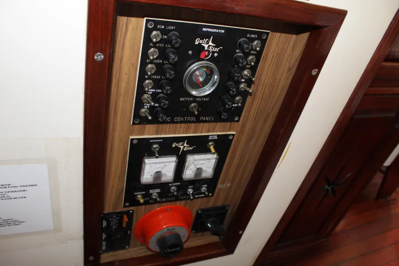 Slide: The Image of 1973 Gulfstar 41 Ketch CC control panel with gauges and switches. - 17