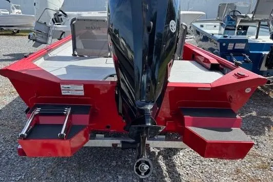 Slide: The Image of 2026 SeaArk Shadow 18 boat, red exterior, rear view with motor and swim platforms. - 6