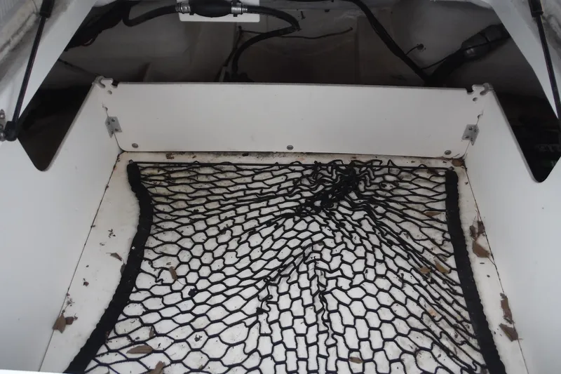 Slide: The Image of Storage compartment with netting in 2018 Chaparral 21 H2O Sport OB boat. - 25