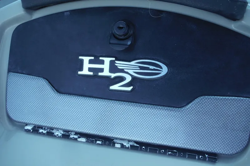 Slide: The Image of 2018 Chaparral 21 H2O Sport OB logo on boat interior panel. - 27