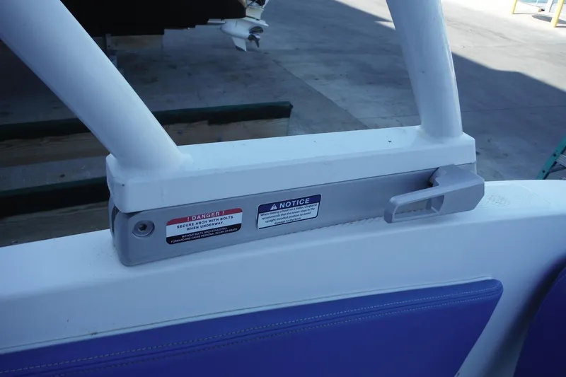 Slide: The Image of 2018 Chaparral 21 H2O Sport OB boat safety warning label and handle detail. - 33