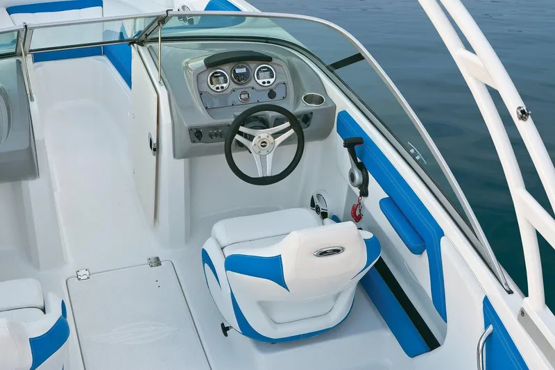 Slide: The Image of Manufacturer Provided Image: 2018 Chaparral 21 H2O Sport OB boat interior with steering wheel and dashboard. - 4