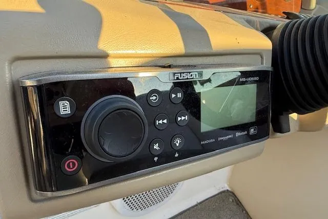 Slide: The Image of 2010 Regal 2300 Bowrider interior with beige and white seating. - 10