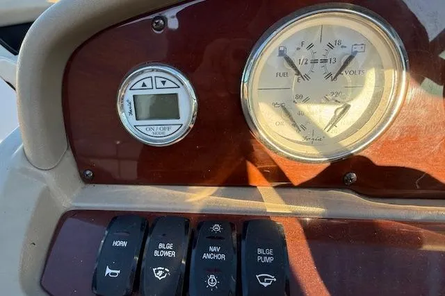 Slide: The Image of Dashboard of 2010 Regal 2300 Bowrider with gauges and Fusion stereo system. - 8