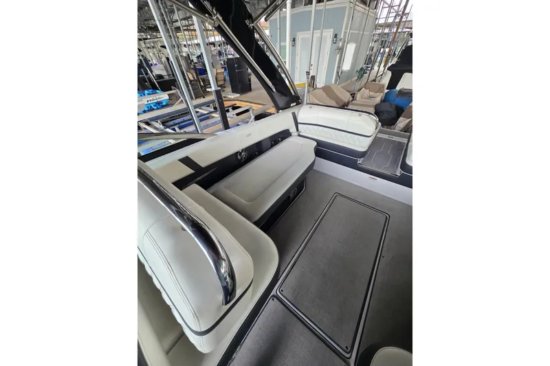 Slide: The Image of 2021 Regal 2800 Bowrider interior with white seating and sleek design. - 15