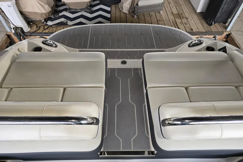 Slide: The Image of 2021 Regal 2800 Bowrider boat interior with cushioned seating and sleek design. - 22