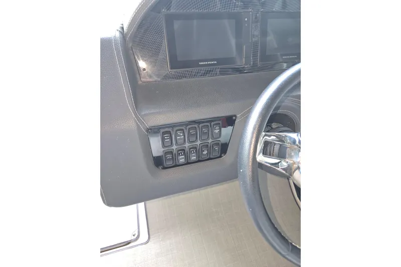 Slide: The Image of Dashboard of 2021 Regal 2800 Bowrider with control panel and steering wheel. - 29