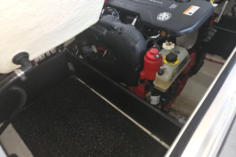 Slide: The Image of Engine compartment of a 2021 Regal 2800 Bowrider boat, showcasing detailed components. - 36