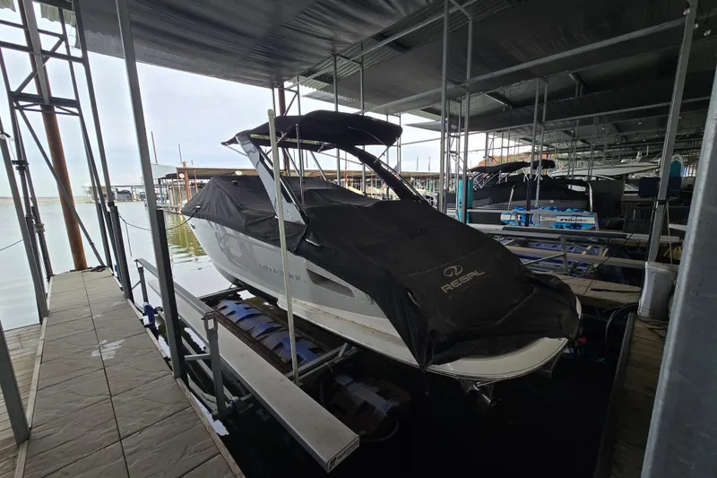 Slide: The Image of 2021 Regal 2800 Bowrider covered in a marina dock setting. - 40
