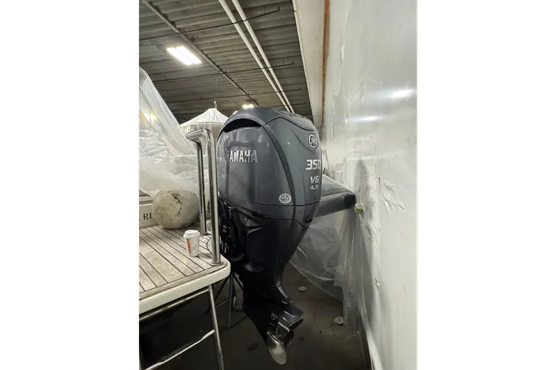 Slide: The Image of Yamaha 350 V6 outboard motor on 2016 Protector Tauranga 41 boat in storage. - 11