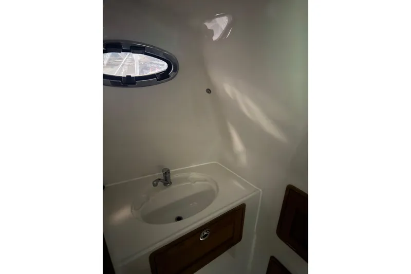 Slide: The Image of Compact bathroom sink in 2016 Protector Tauranga 41 boat interior. - 5