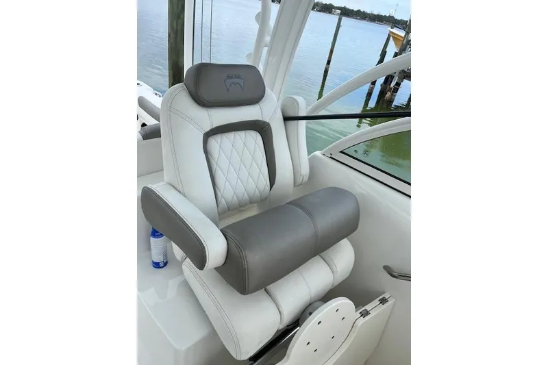 Slide: The Image of Luxury seating on 2022 World Cat 255 DC boat, featuring white and gray upholstery. - 9